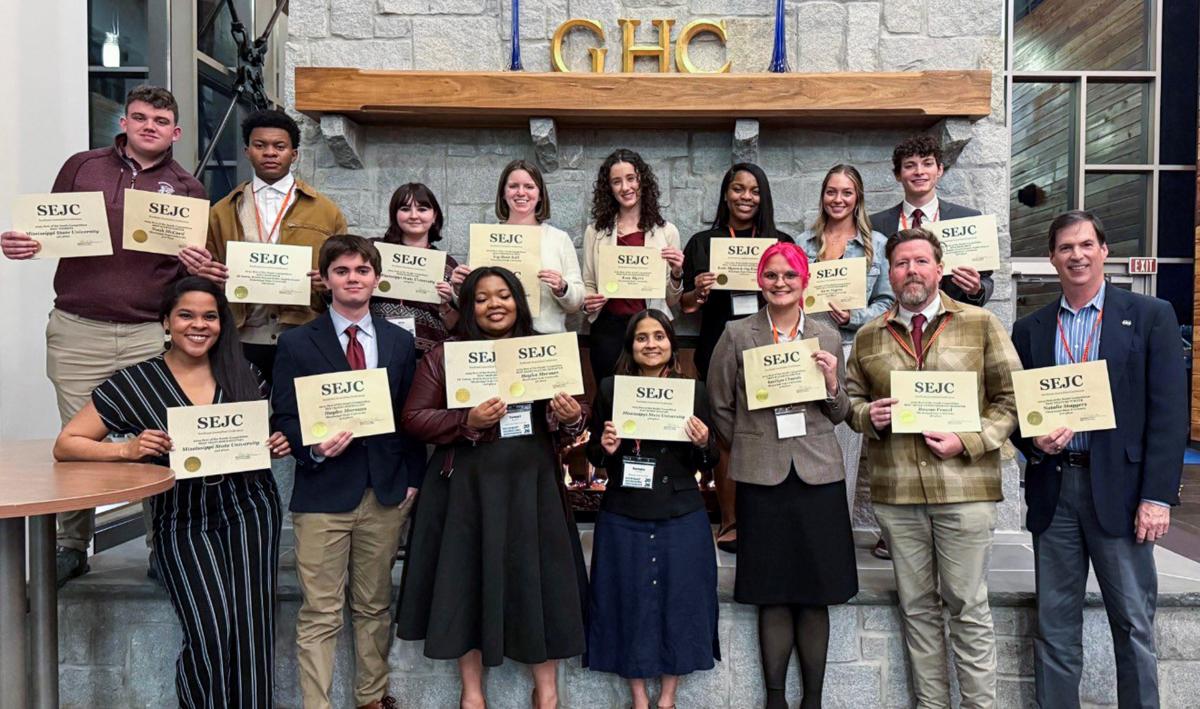 SEJC student group shot holding awards